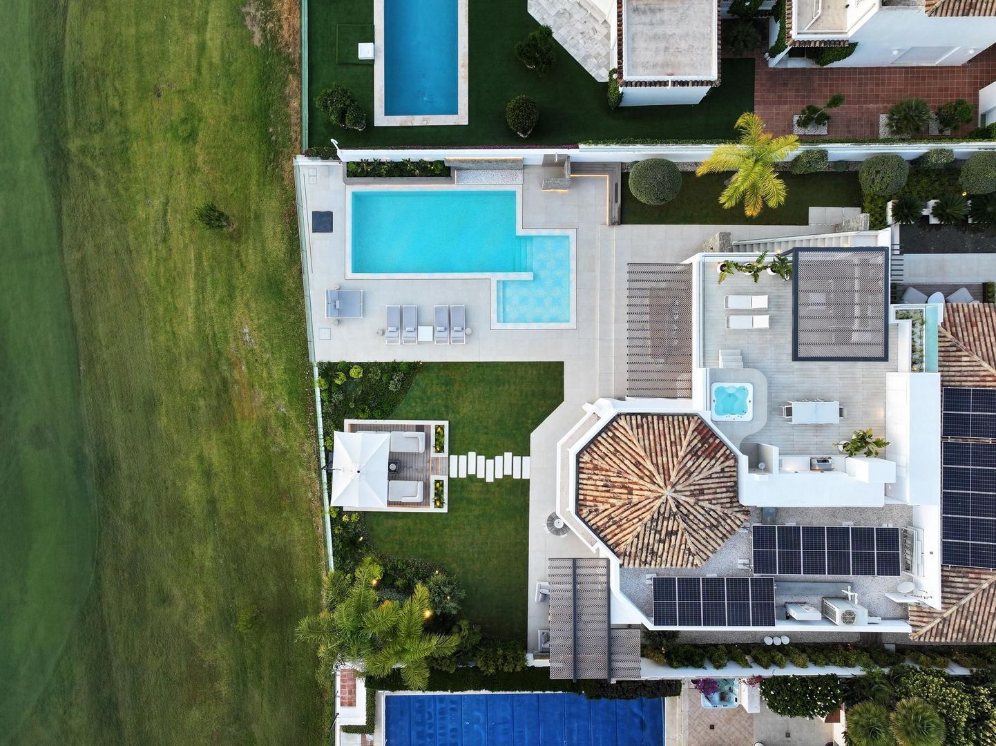 Aerial top view of Villa Aquila showing pool, gardens, roofscape and full residential layout in La Cerquilla