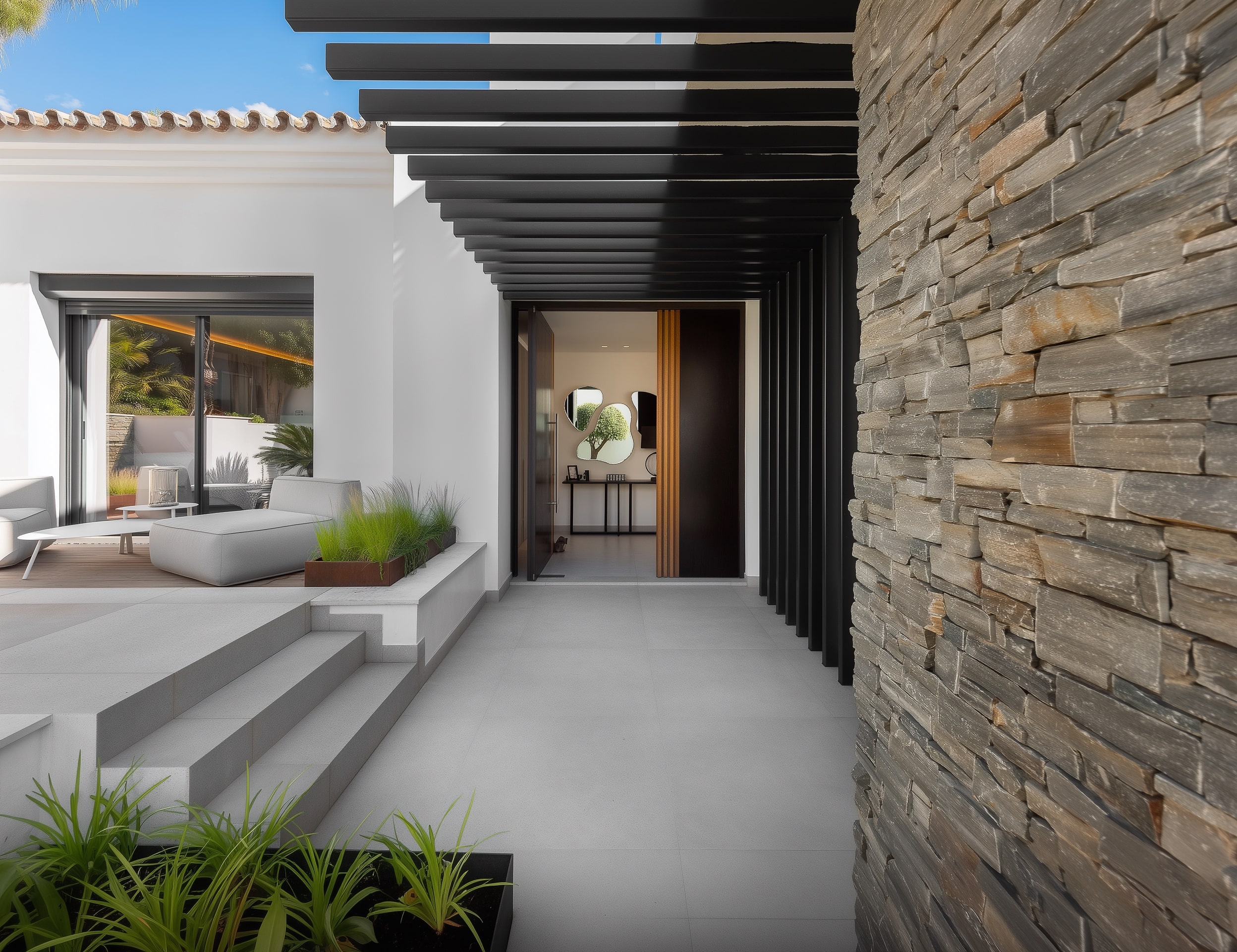 Entrance corridor at Villa Aquila with stone-clad wall, pergola shadows and refined arrival atmosphere