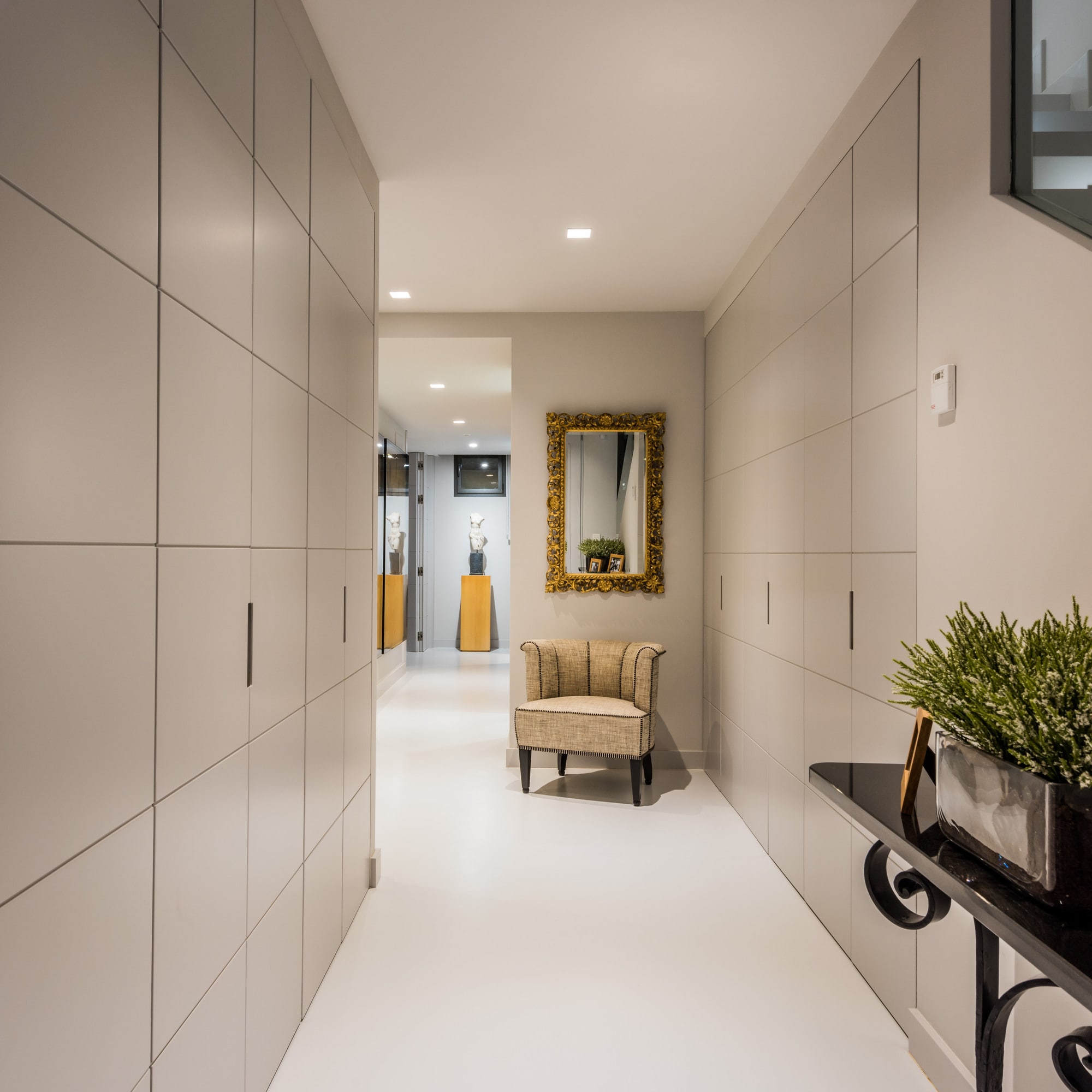 Refined circulation space with integrated cabinetry and soft neutral finishes inside Villa Australia