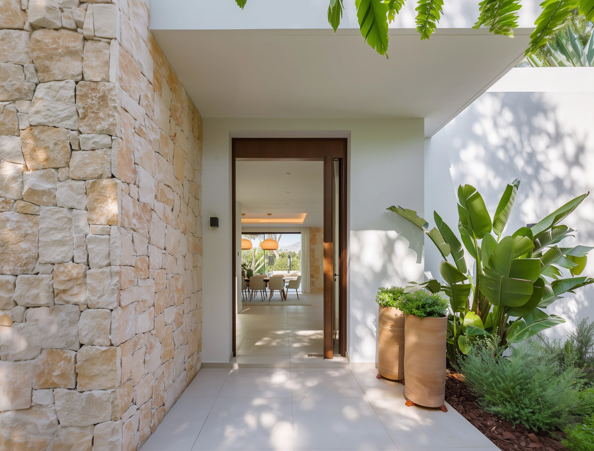 Entrance patio with stone walls and warm Mediterranean atmosphere