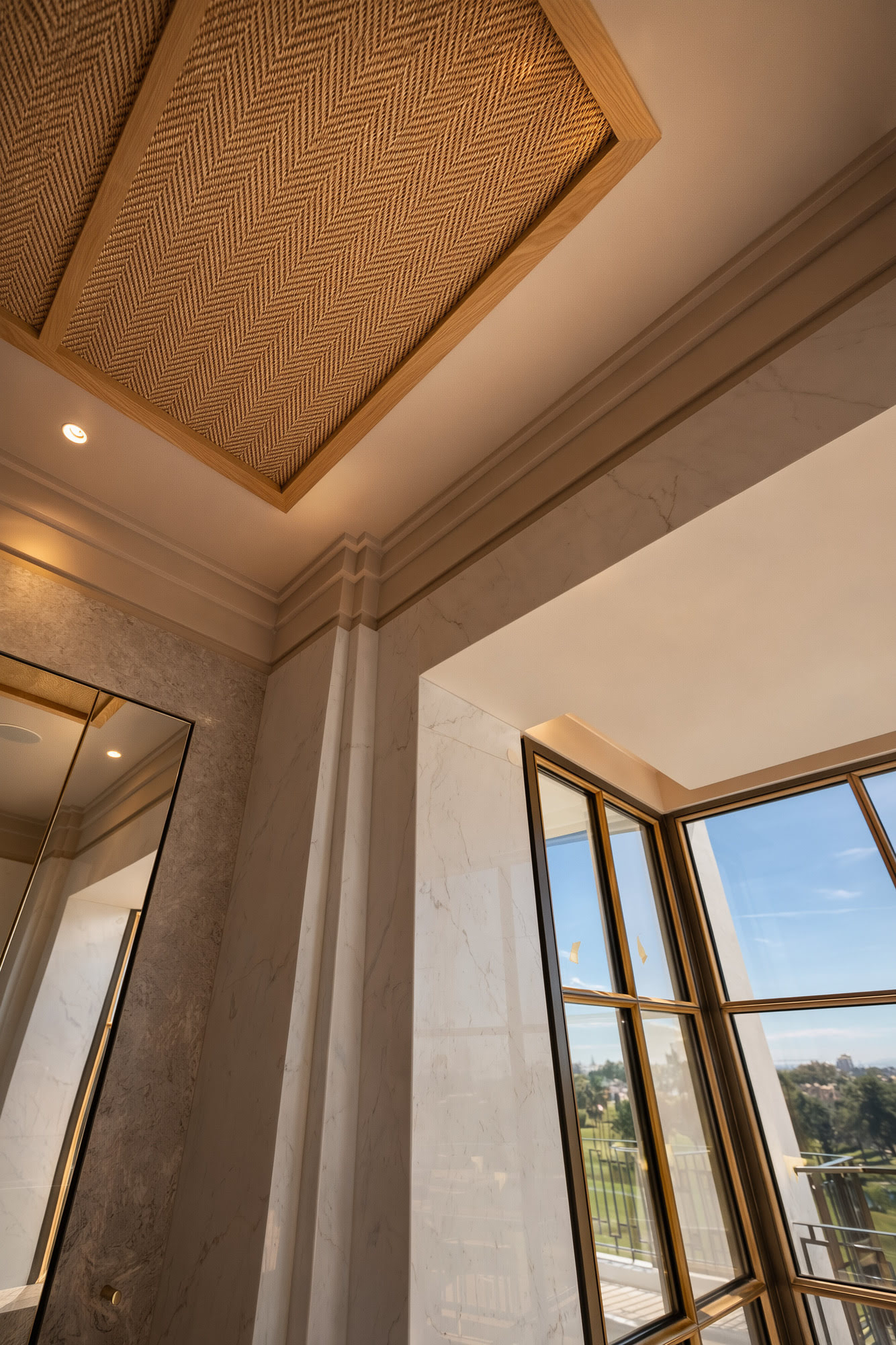 Ceiling moulding detail and framed window composition in the refined interior architecture of Villa Diva