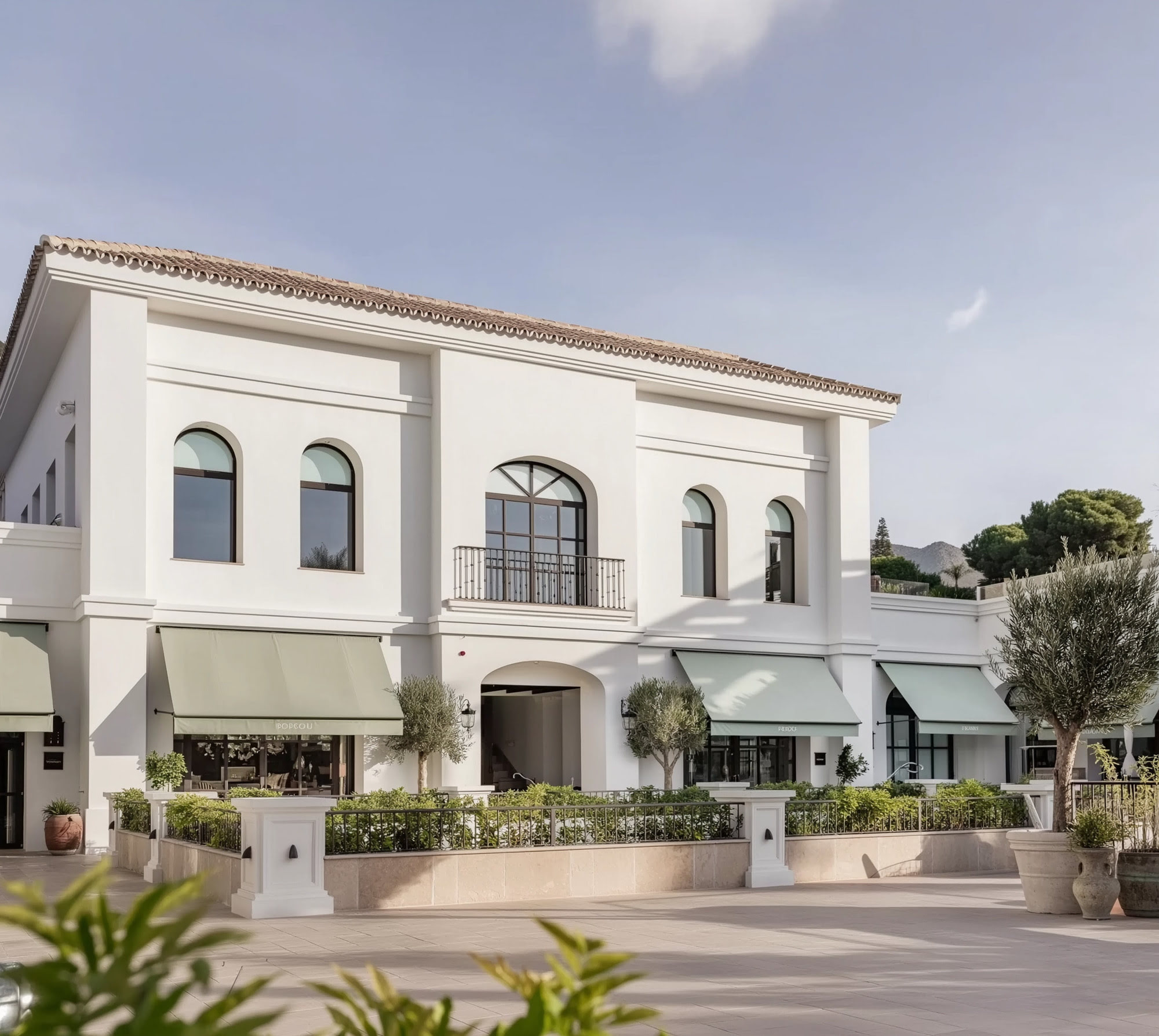 Exterior perspective of FORUM showing refined façades, Mediterranean landscaping and pedestrian-friendly circulation through the commercial destination