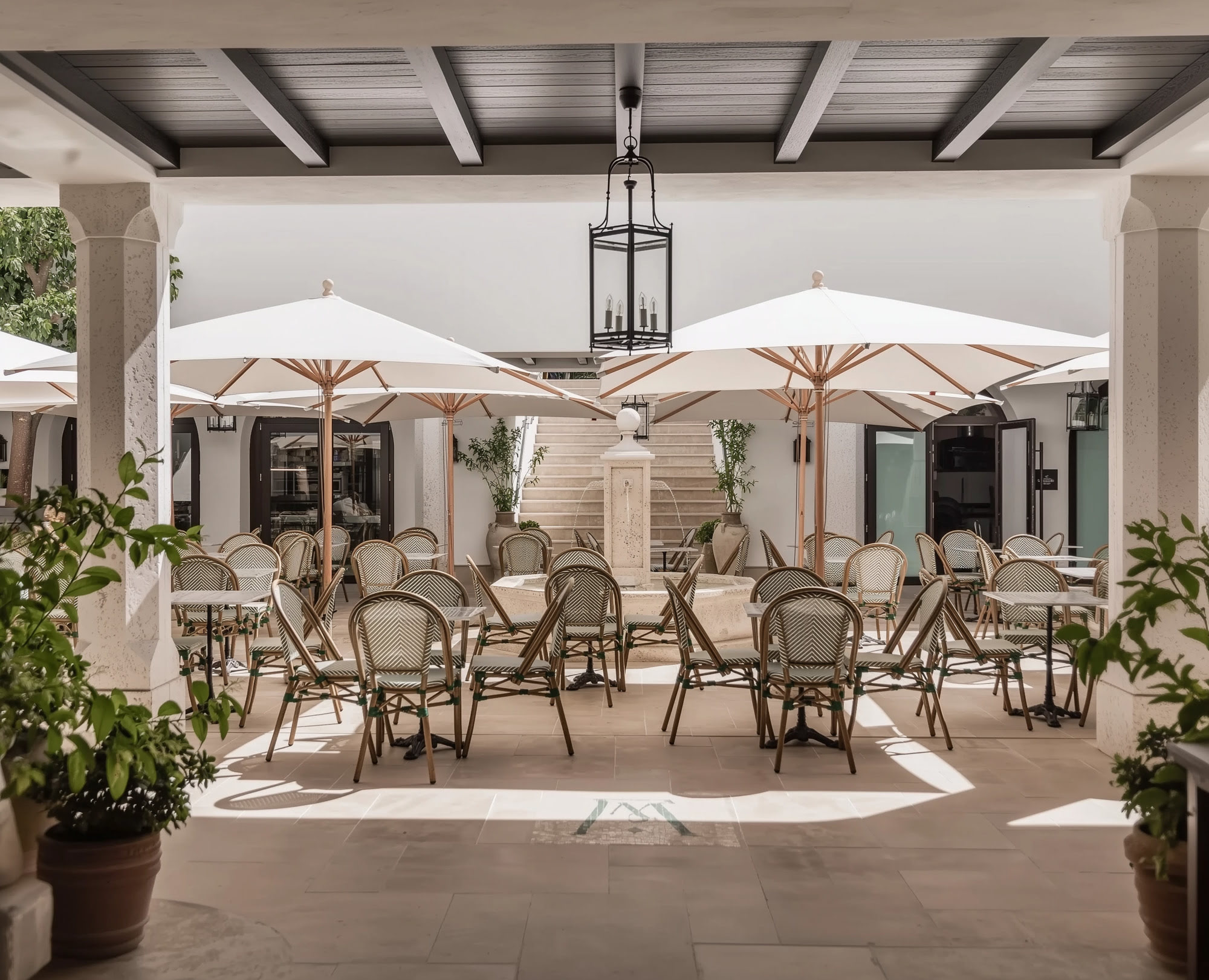 Central terrace and courtyard at FORUM designed for outdoor dining, social gathering and an elegant hospitality experience