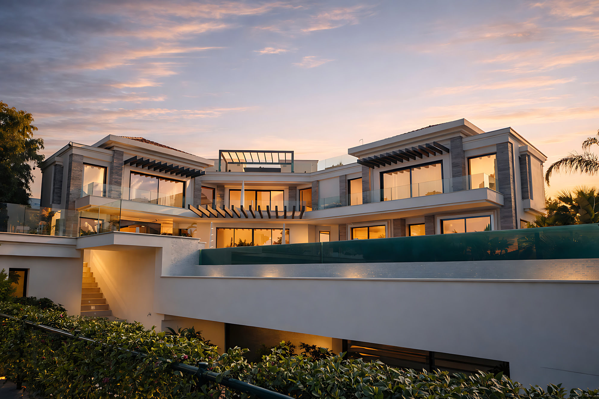 Twilight panoramic view of Hillview Estate with illuminated interiors, long pool edge and cinematic contemporary composition