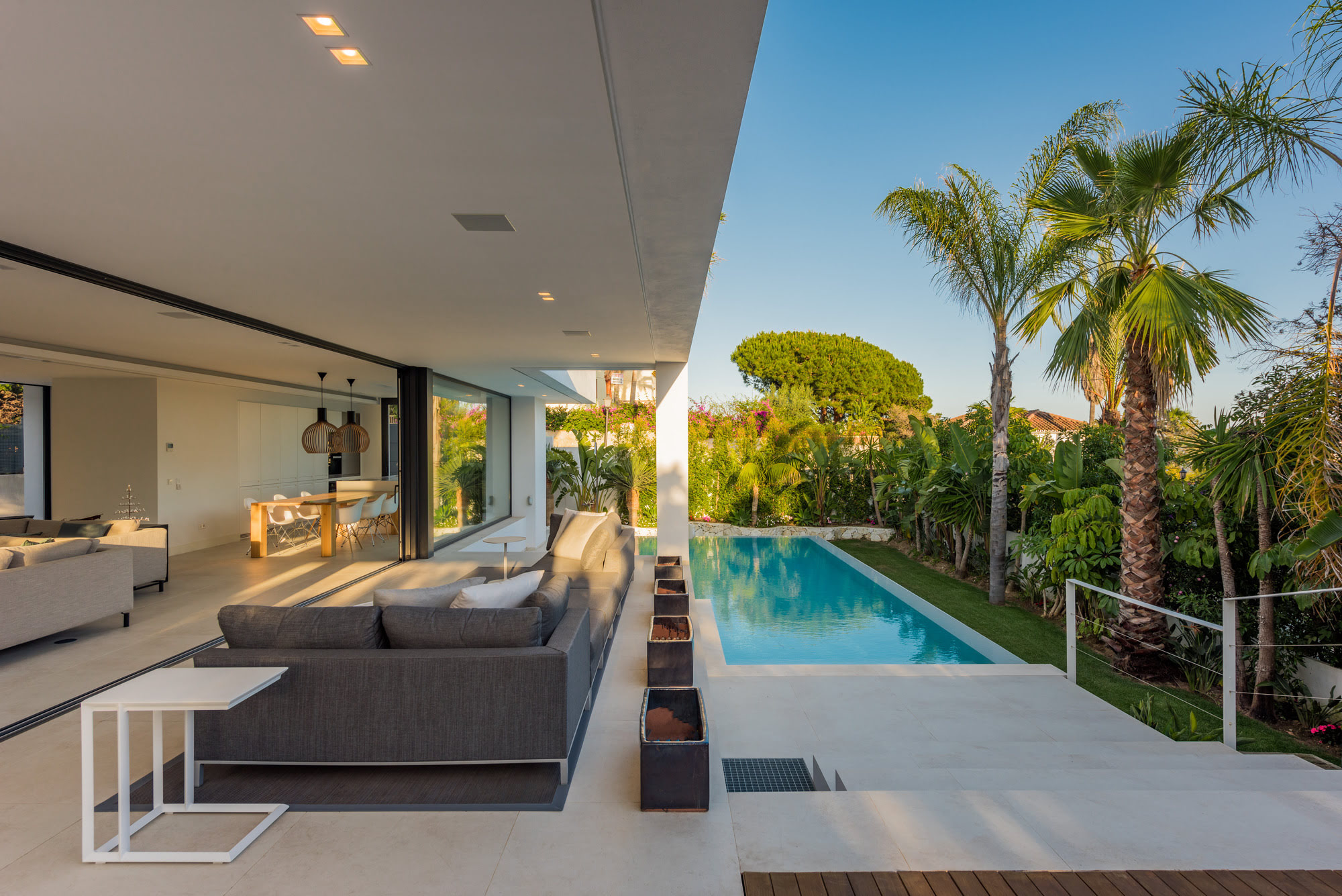 Linear covered terrace and swimming pool at M152 designed for luxury outdoor living in Marbella East