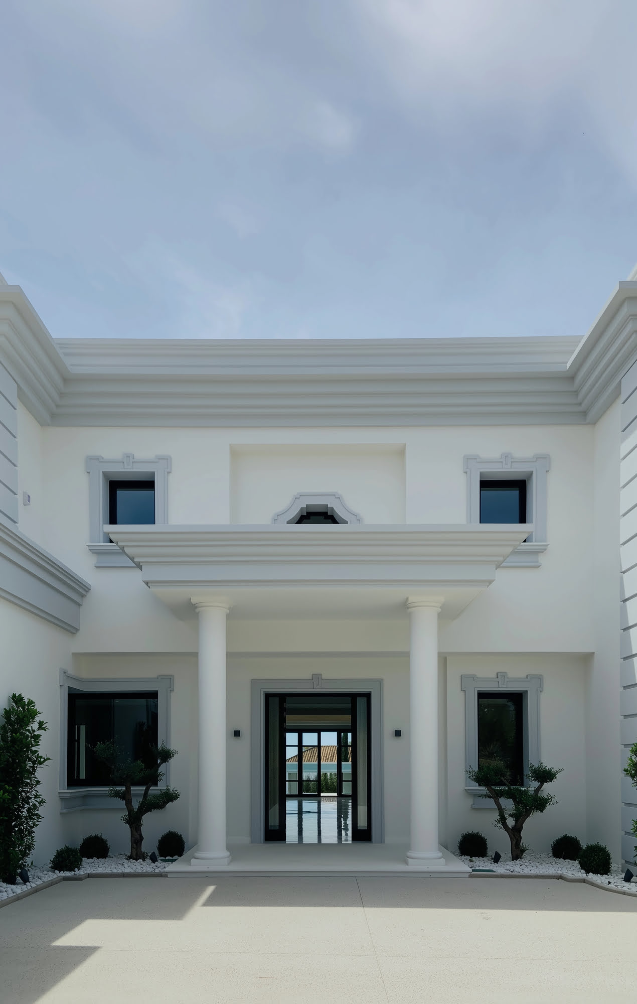 Front entrance courtyard of Villa Mariselena in La Zagaleta, Benahavís, with symmetrical classical façade and central portico