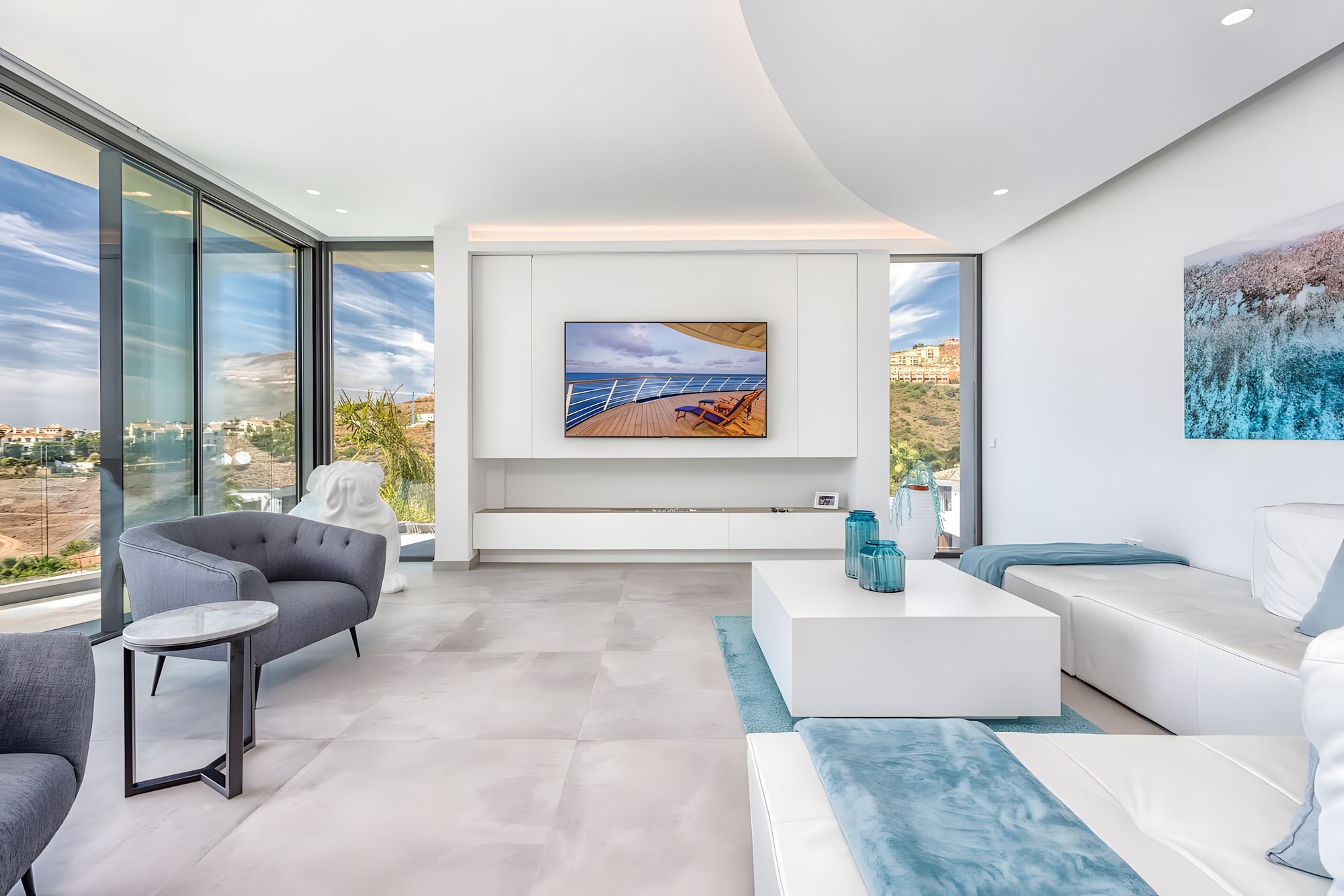 Contemporary living room at Villa Origami with full-height glazing and seamless connection to the terrace