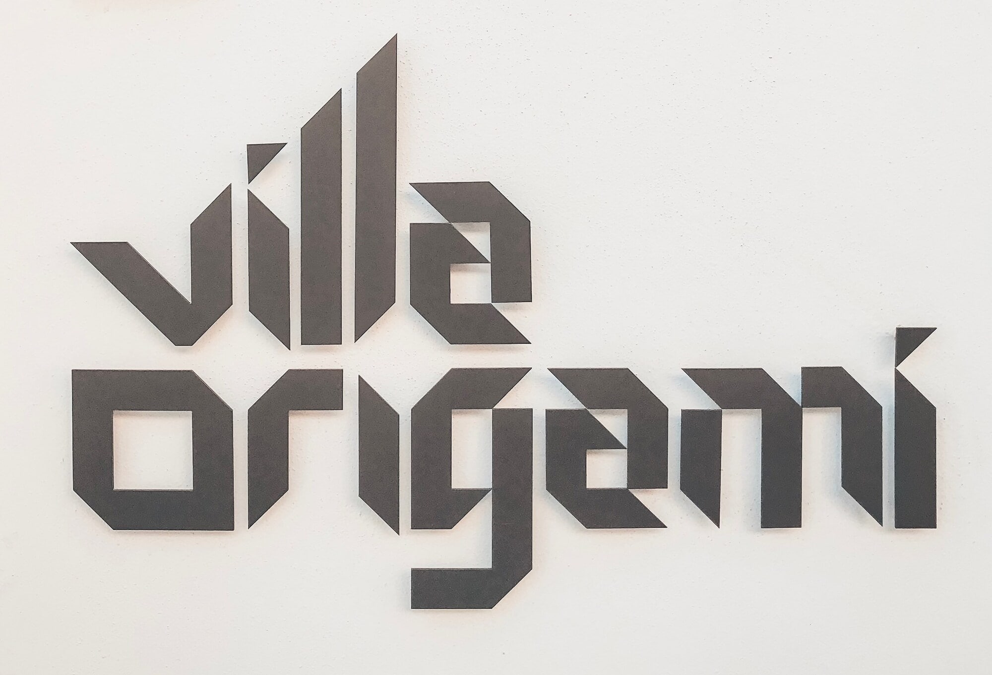 Villa Origami project identity graphic closing the architectural gallery