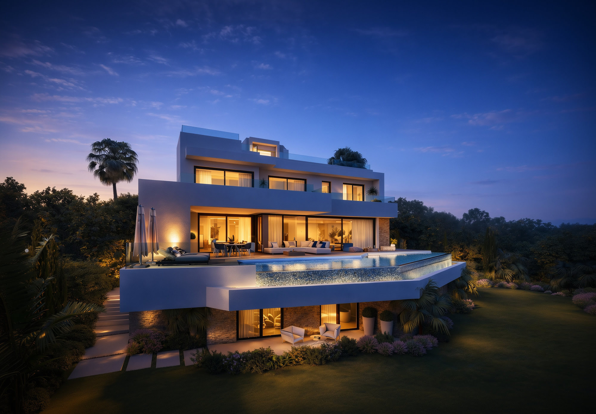 Night exterior of Villa Riviera with illuminated volumes and elevated pool terrace