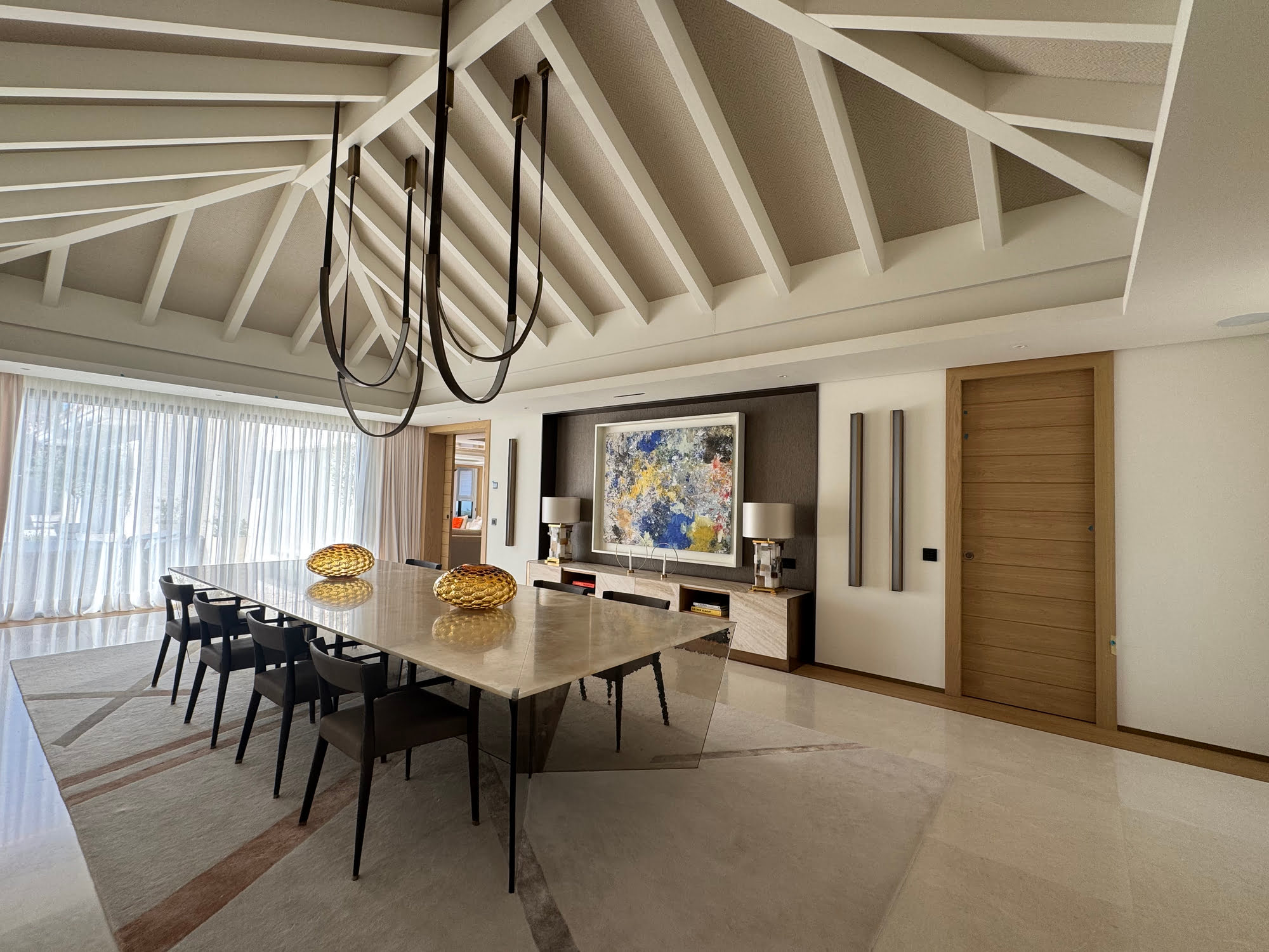 Vaulted dining room at Villa Shangri-La with timber ceiling, chandelier and soft natural light