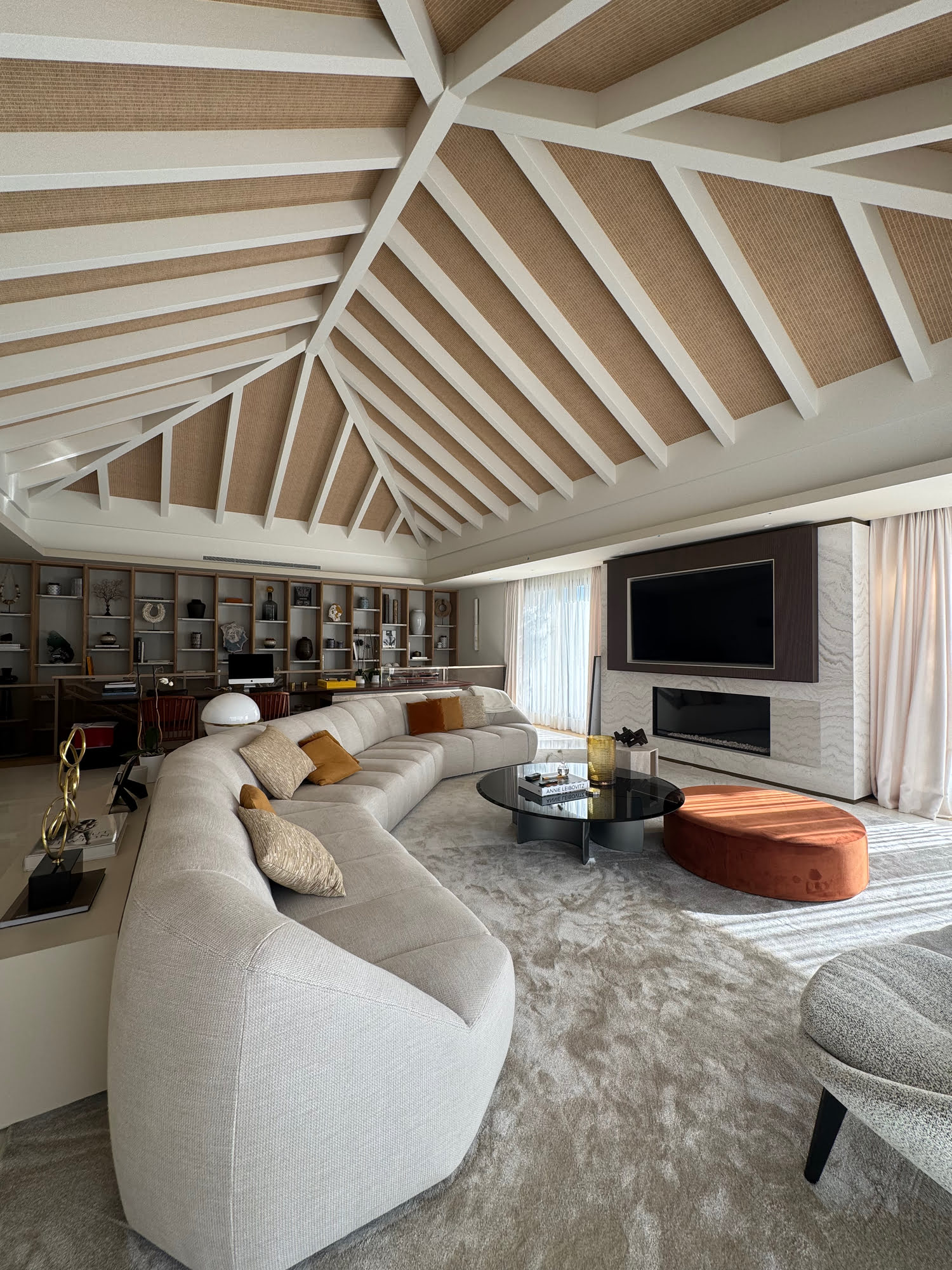 Curved lounge at Villa Shangri-La with sculptural ceiling geometry and refined neutral furnishings