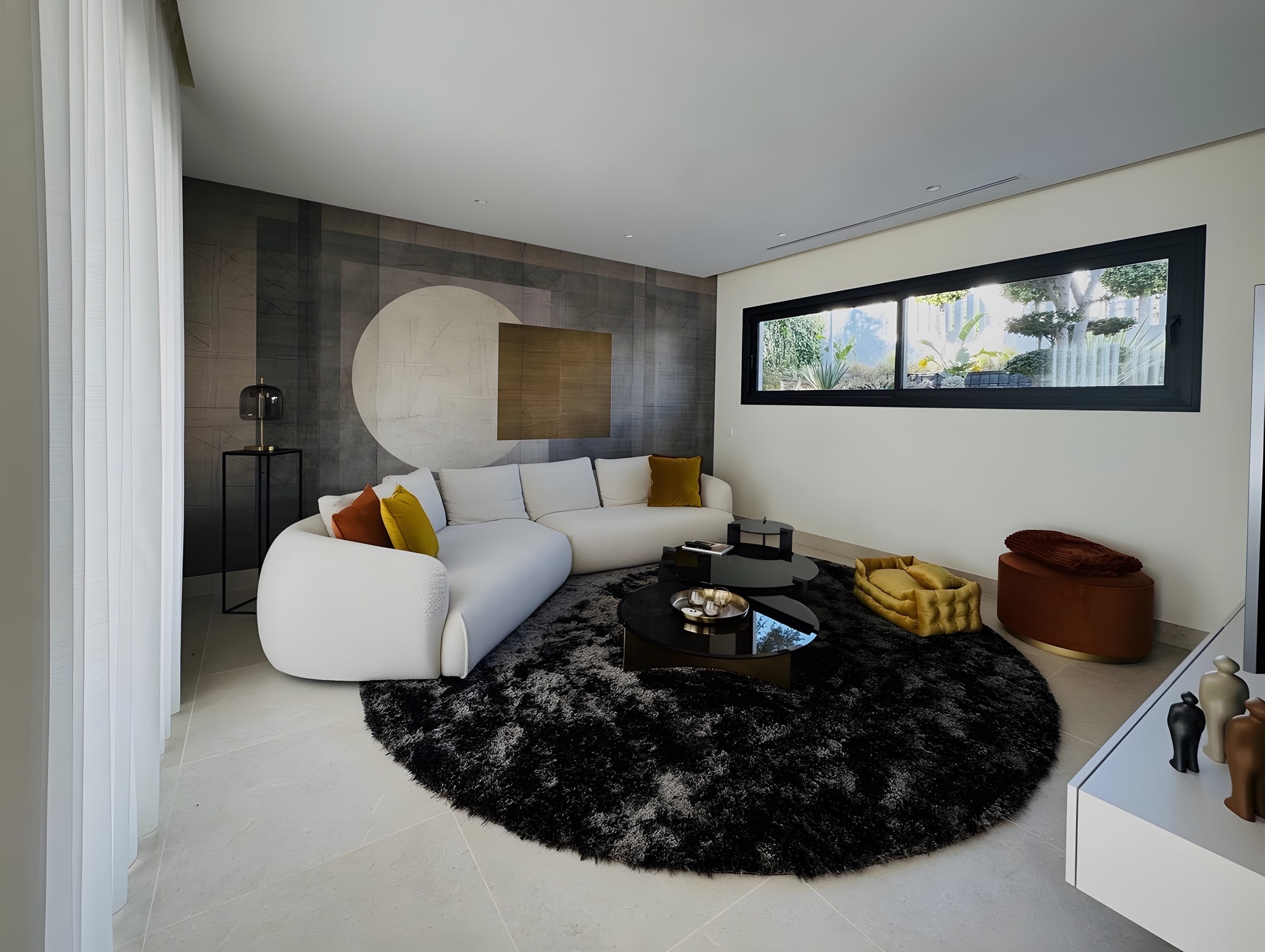 Secondary sitting room with soft curved furniture and intimate lighting palette