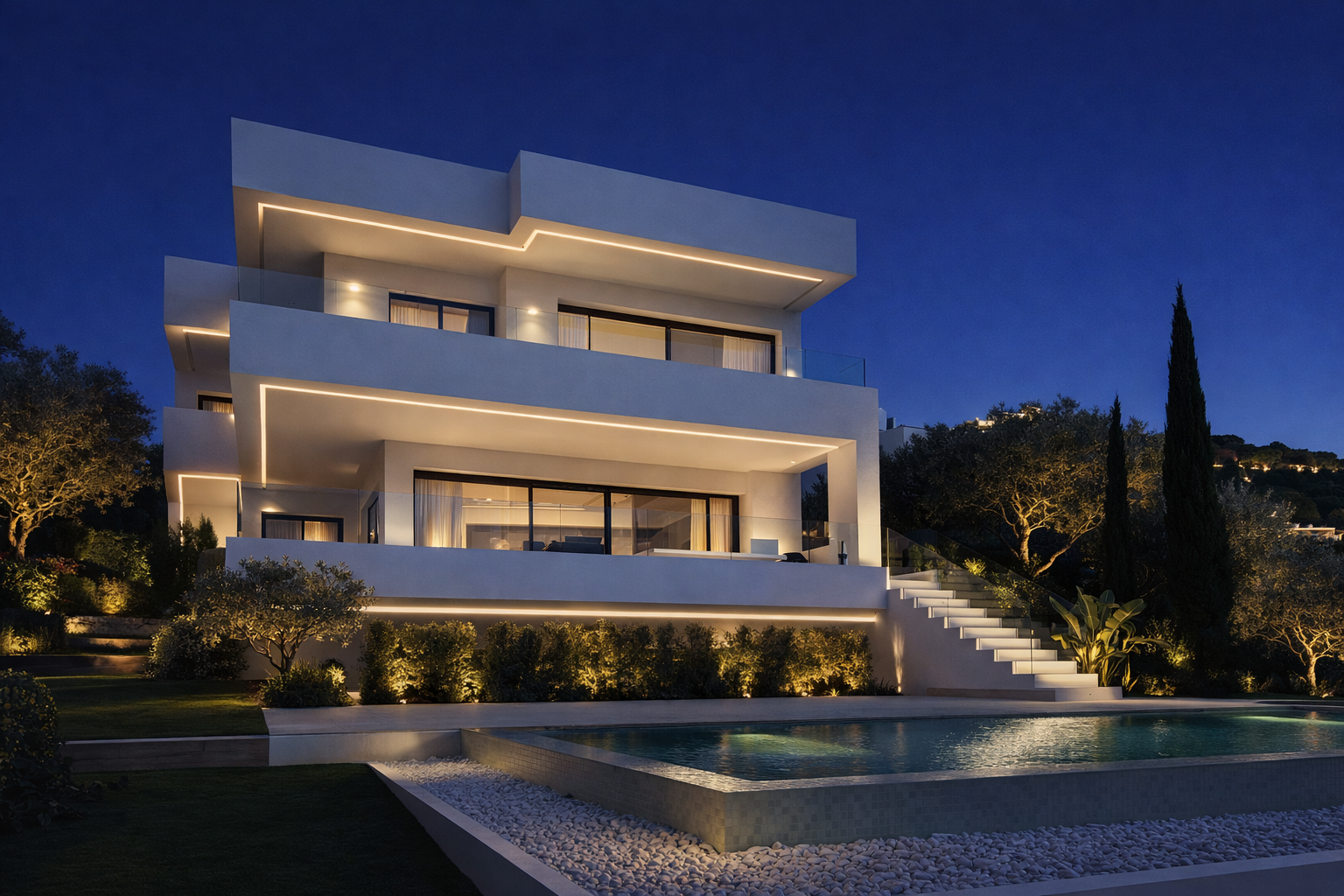 Dusk exterior view of Casa Sonuwe with illuminated terraces and swimming pool in Estepona