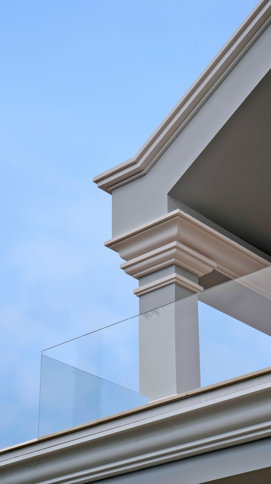 Detail of cornice, column capital and glass balustrade at Villa Tanya