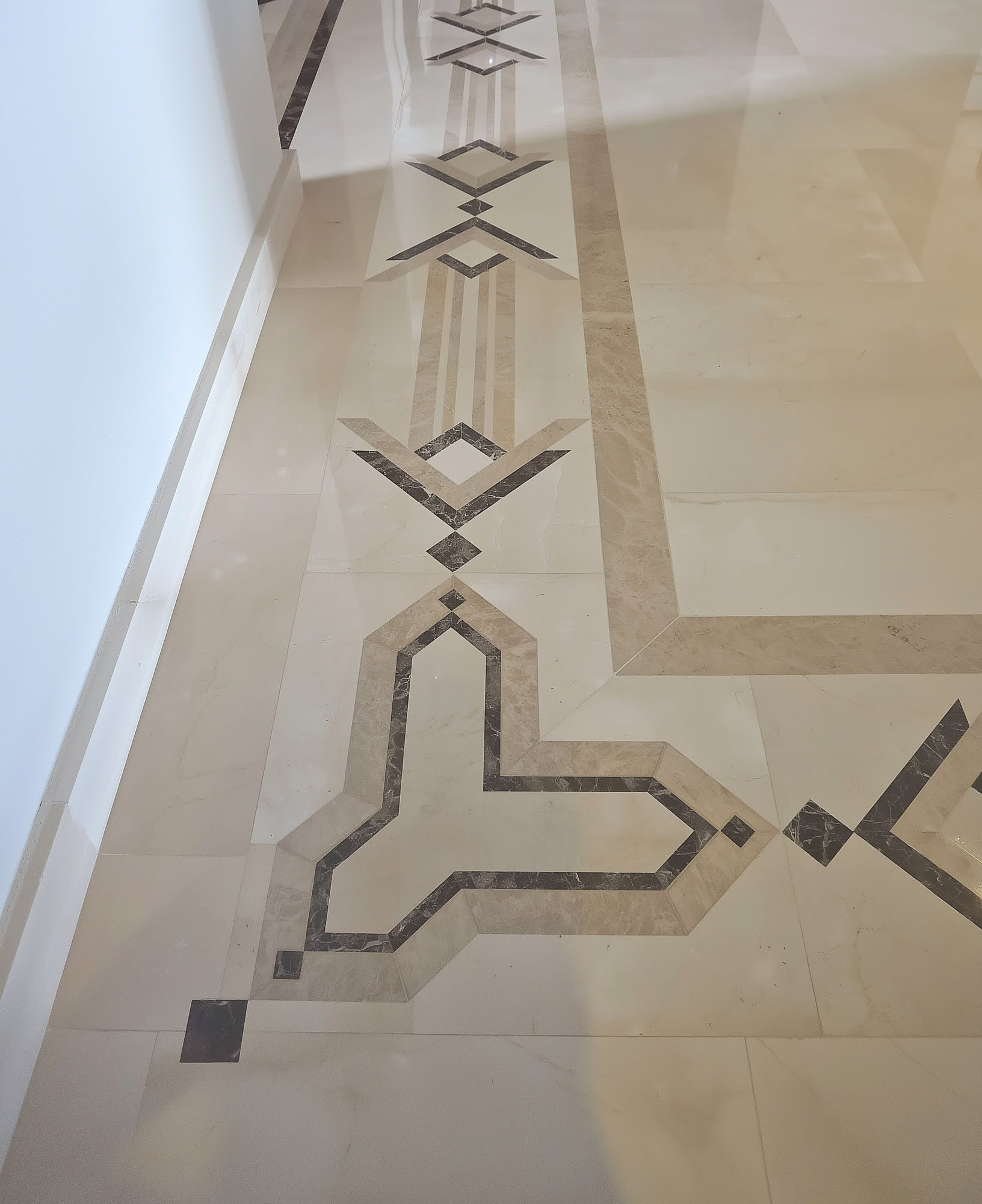 Decorative marble floor inlay detail inside Villa Tanya