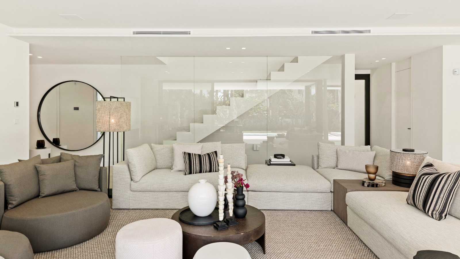 Open-plan living area at VIDA DEL MAR with soft tones, layered seating and refined contemporary calm