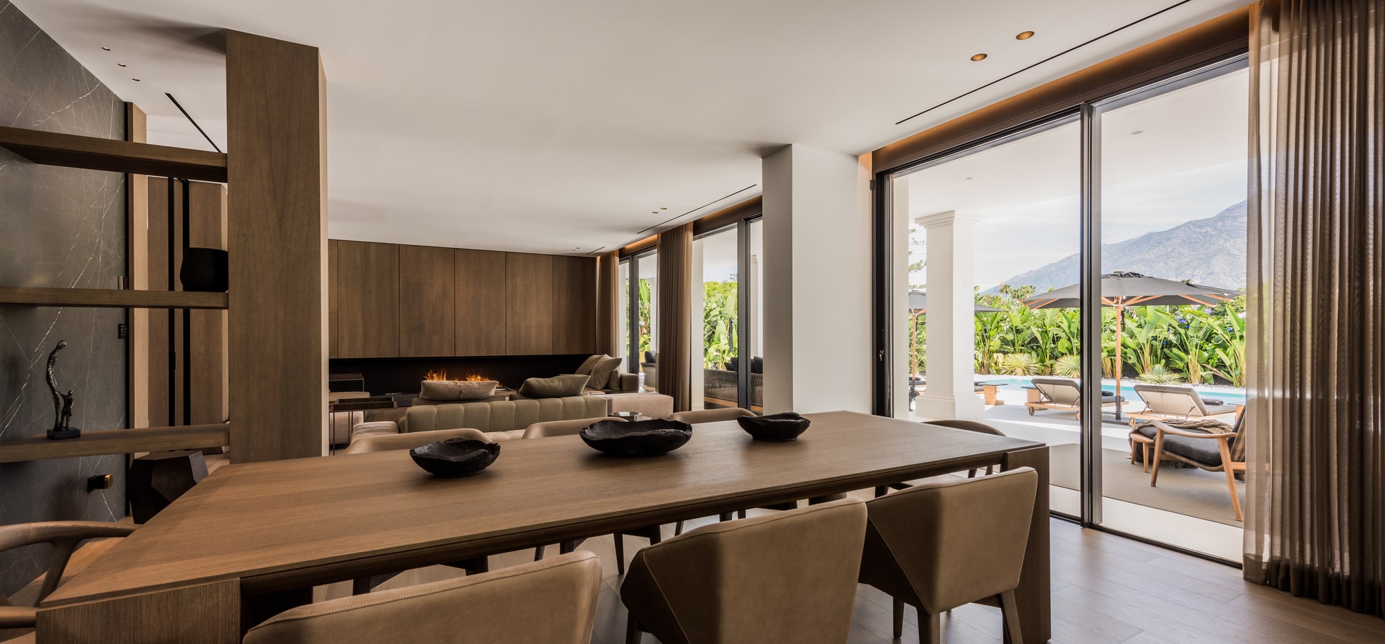 Contemporary kitchen at Villa Zarina with panoramic glazing, integrated cabinetry and a restrained luxury material palette